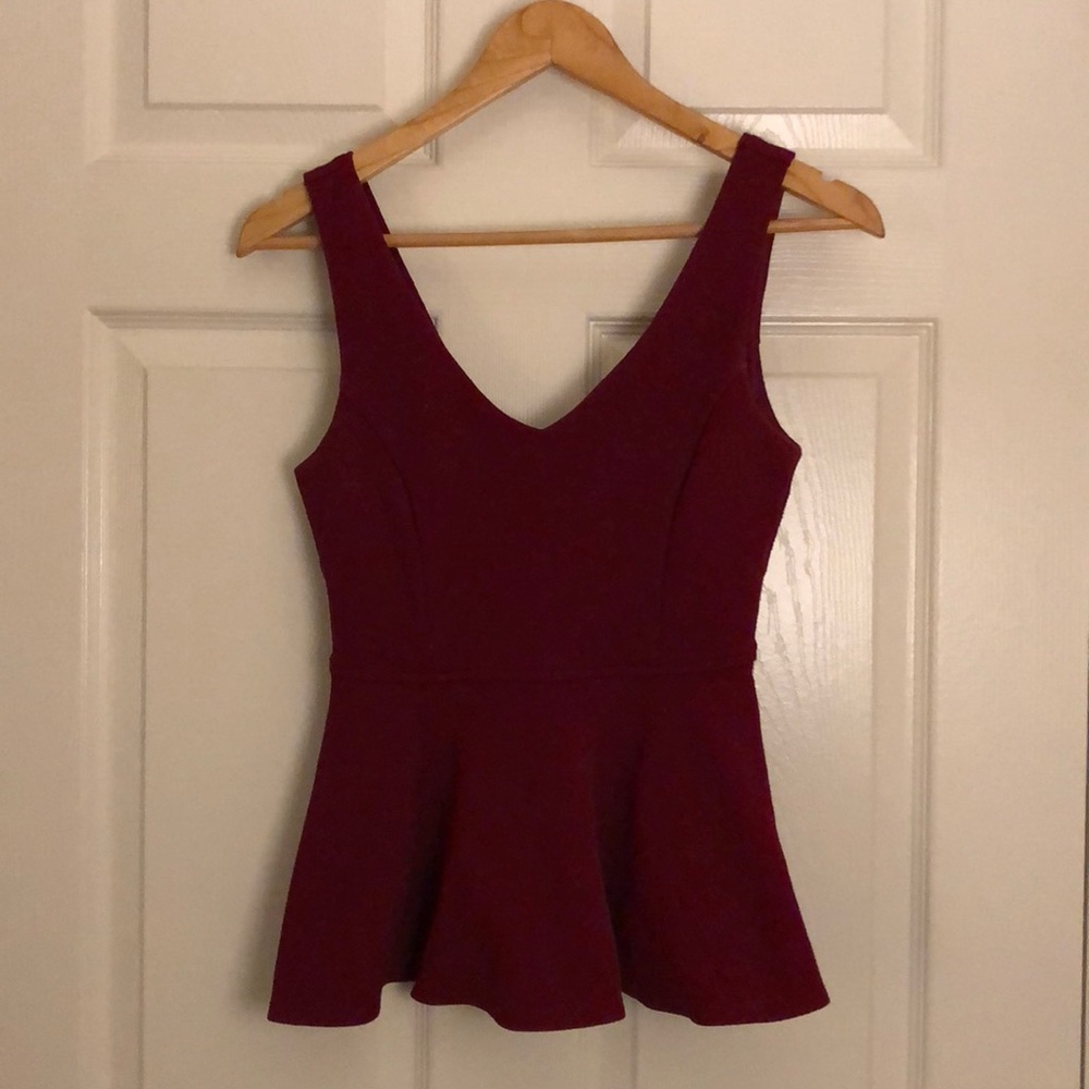 Peplum tank, stretchy material.